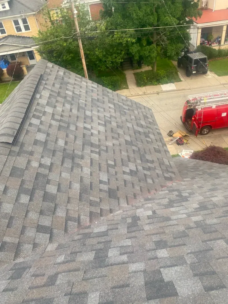 Gray and brown asphalt shingle roof.
