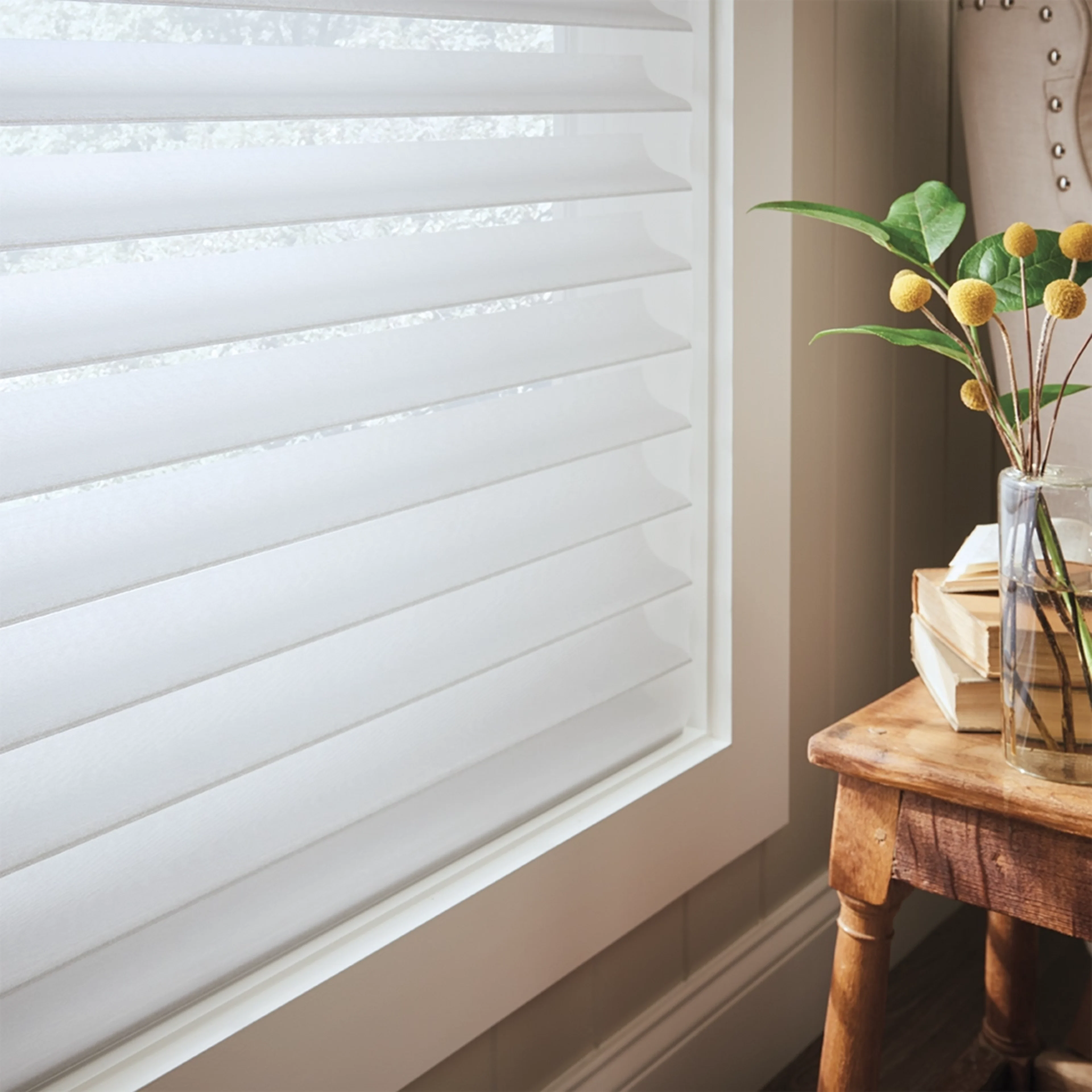 White custom shades on a set of a windows in a chic living room near Cumming, GA