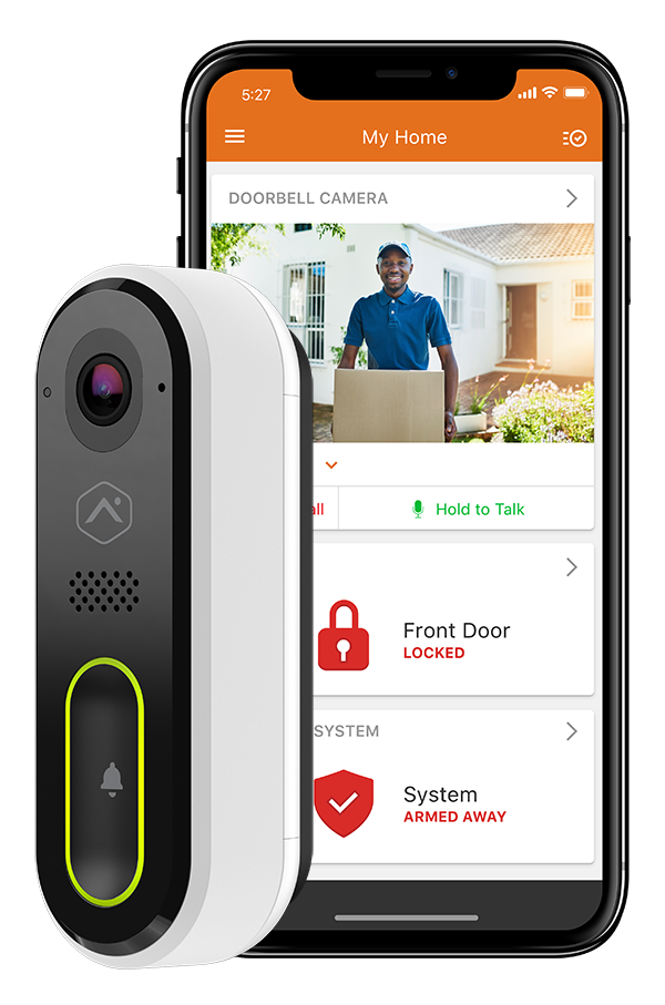 A doorbell camera is sitting next to a cell phone.