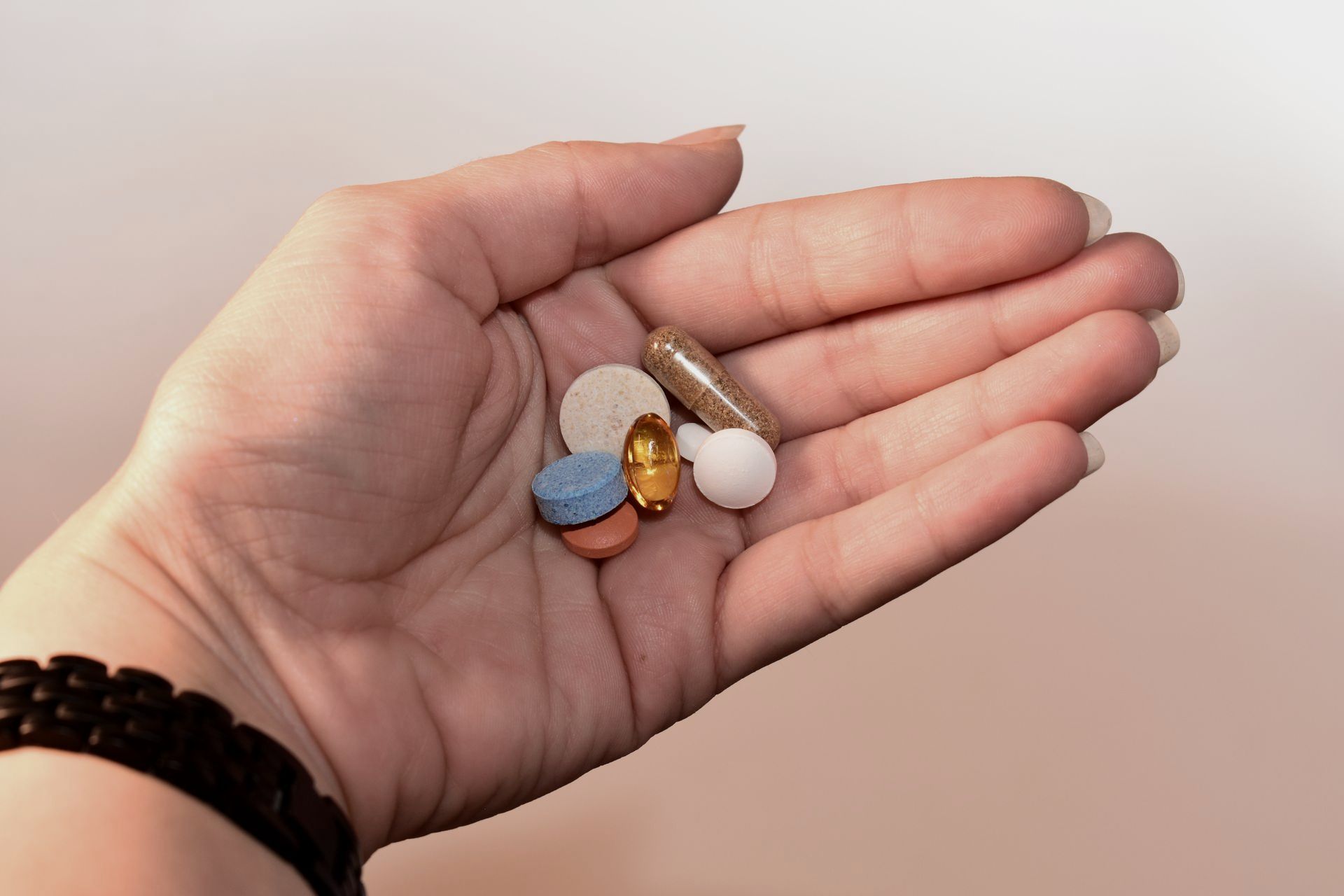 Hand Holding Medication Pill and Capsules Hand Holding Medication Pill and Capsules