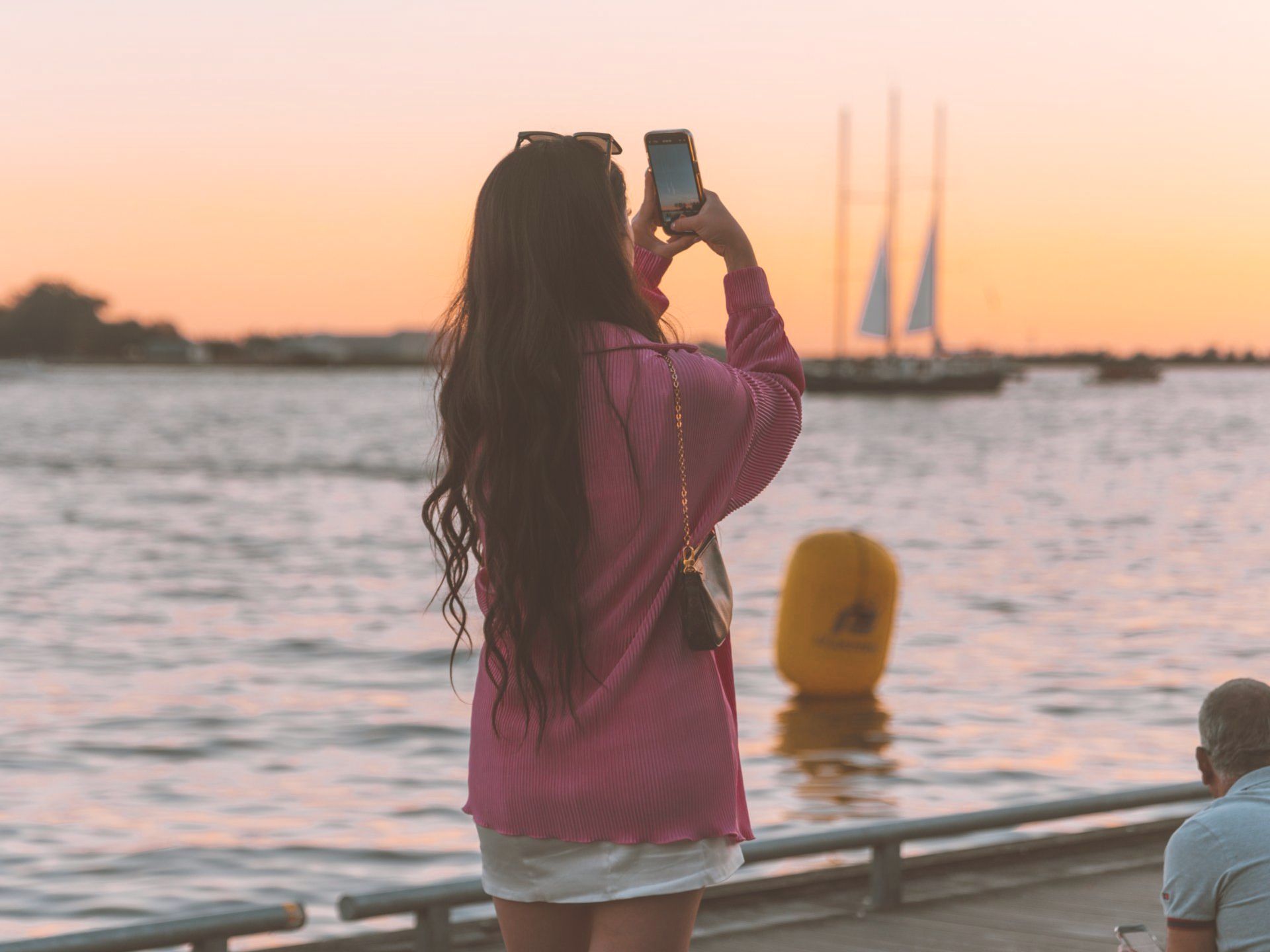 Woman Photographing the Sunset Woman Photographing the Sunset