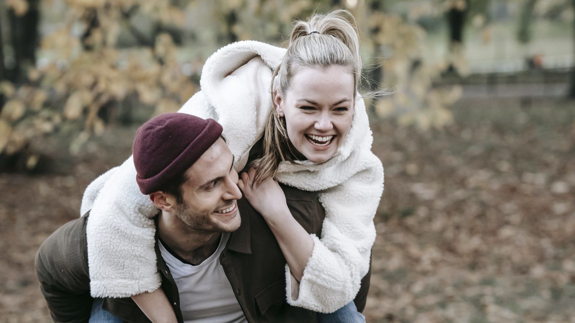 Man Giving Piggyback Ride to His Girlfriend Man Giving Piggyback Ride to His Girlfriend