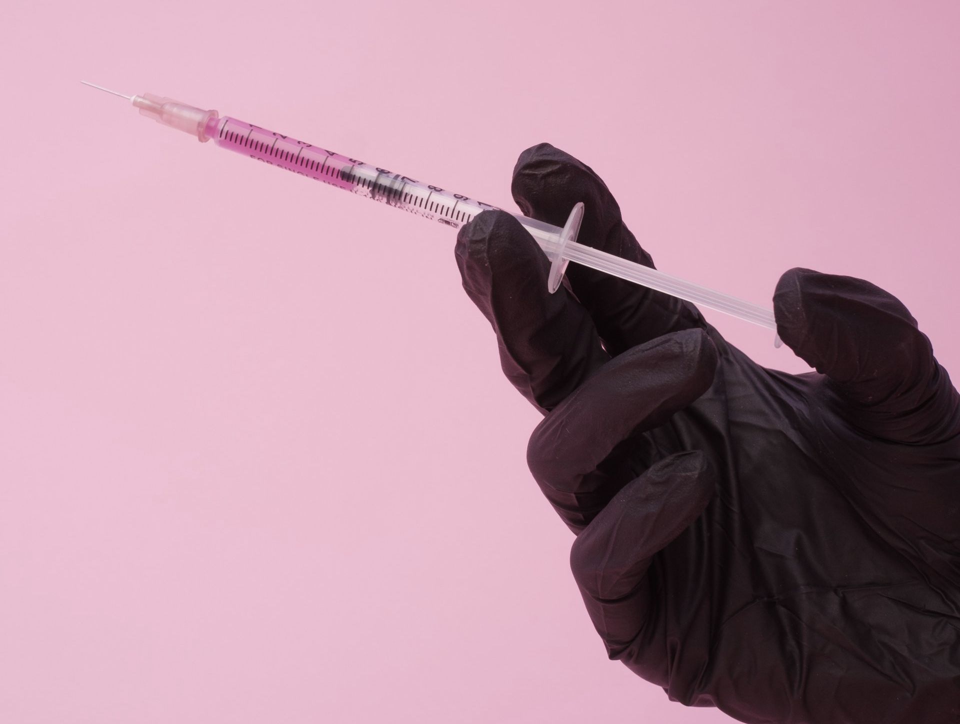 Hand Holding Syringe Hand Holding Syringe