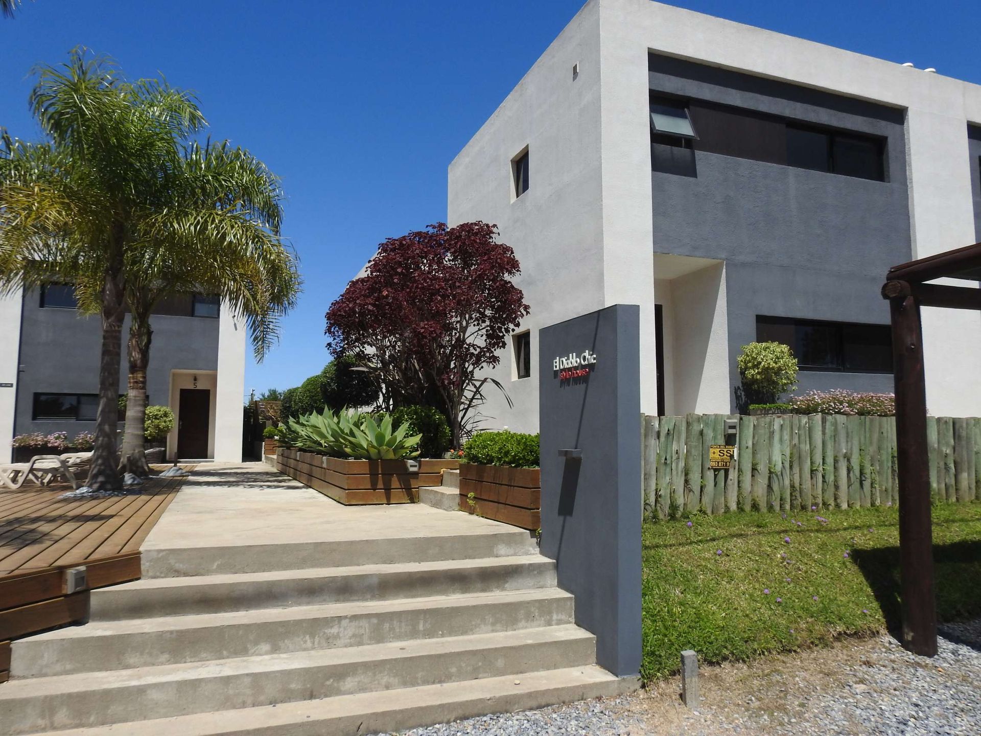 A large white building with stairs leading up to it