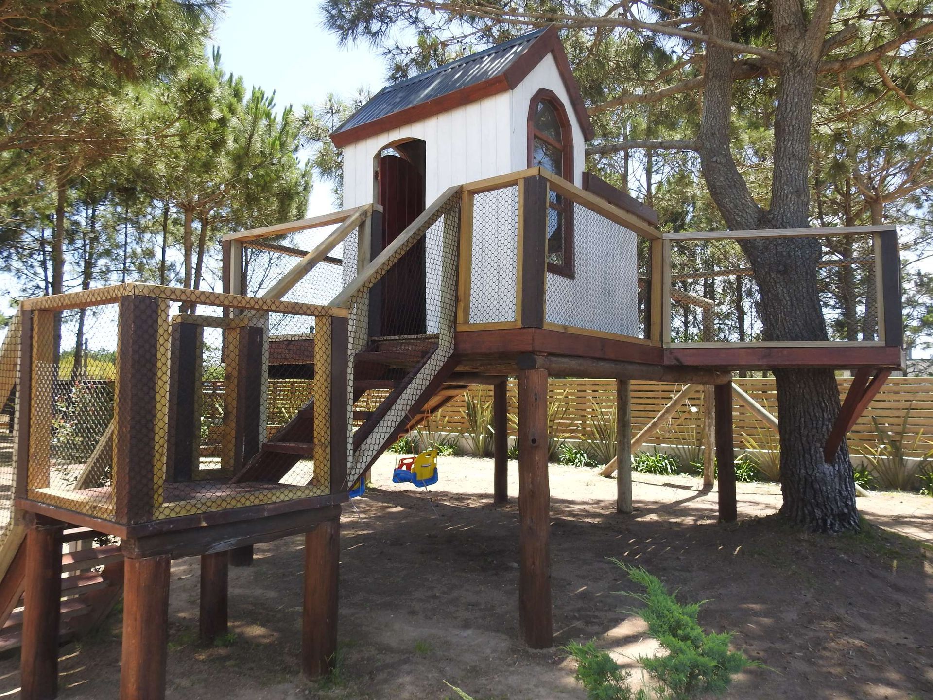 A tree house with stairs leading up to it