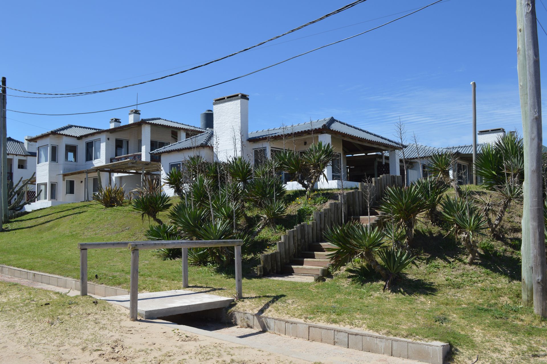 A house on a hill with stairs leading up to it