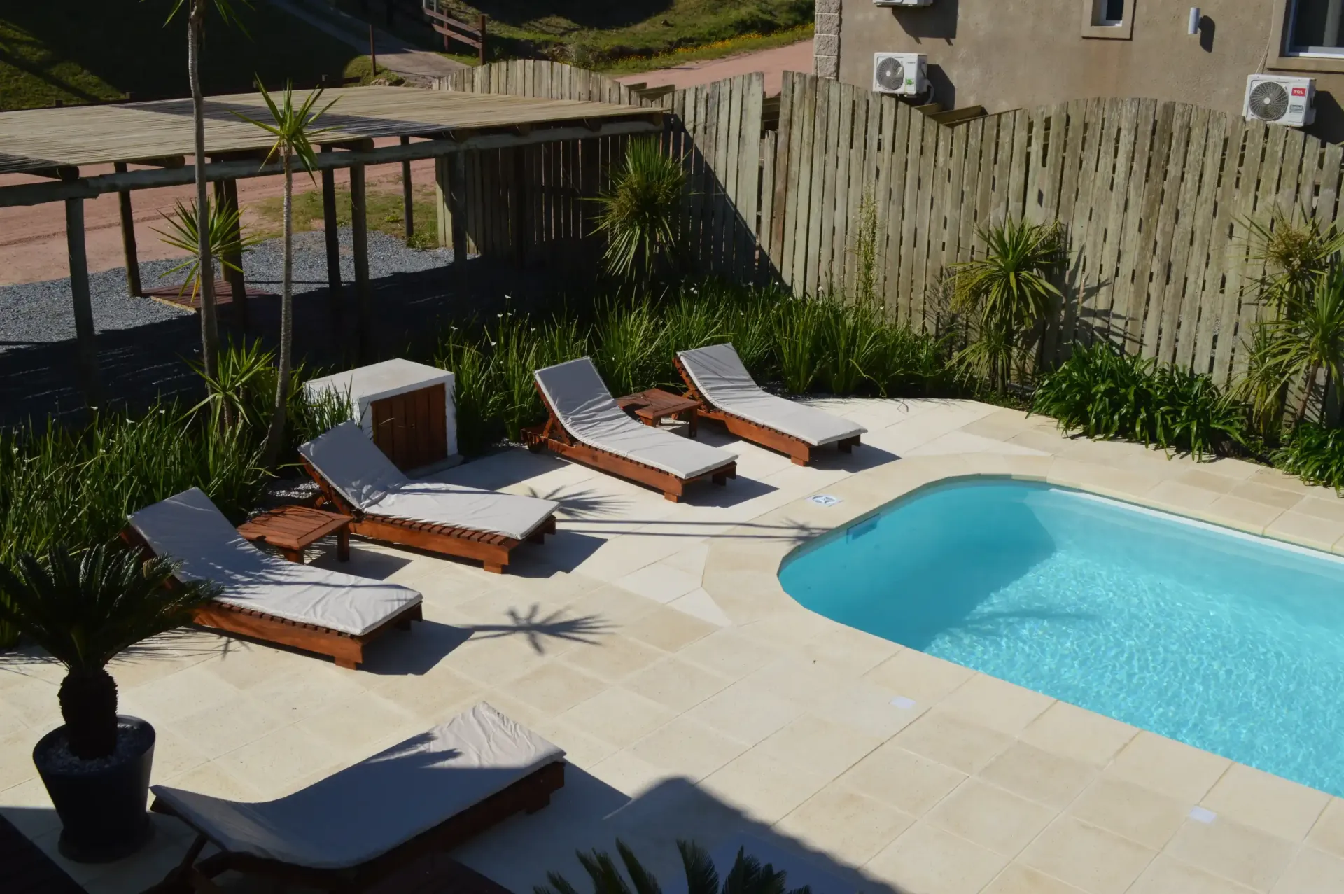 A swimming pool with a lot of chairs around it