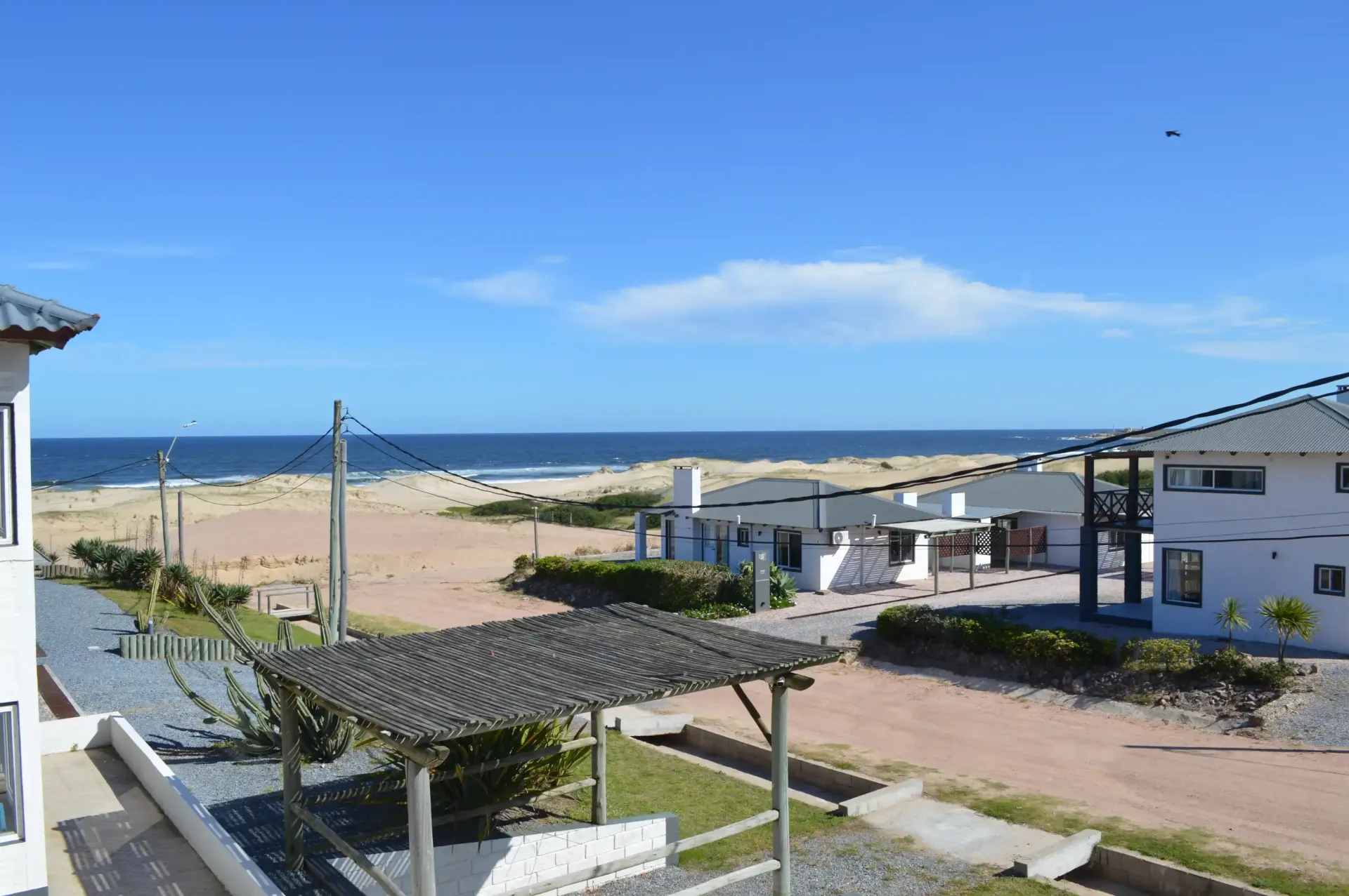 A view of the ocean from the balcony of a house