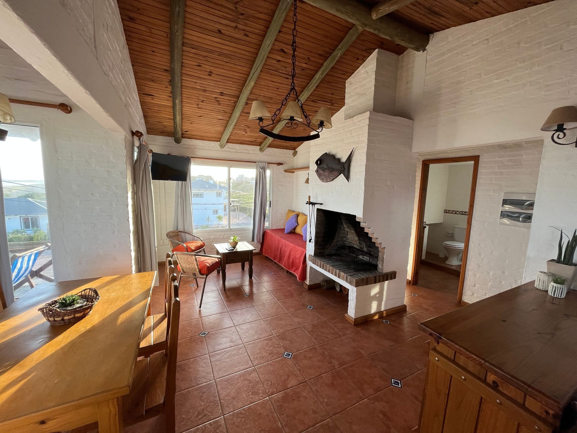 A living room with a fireplace and a couch