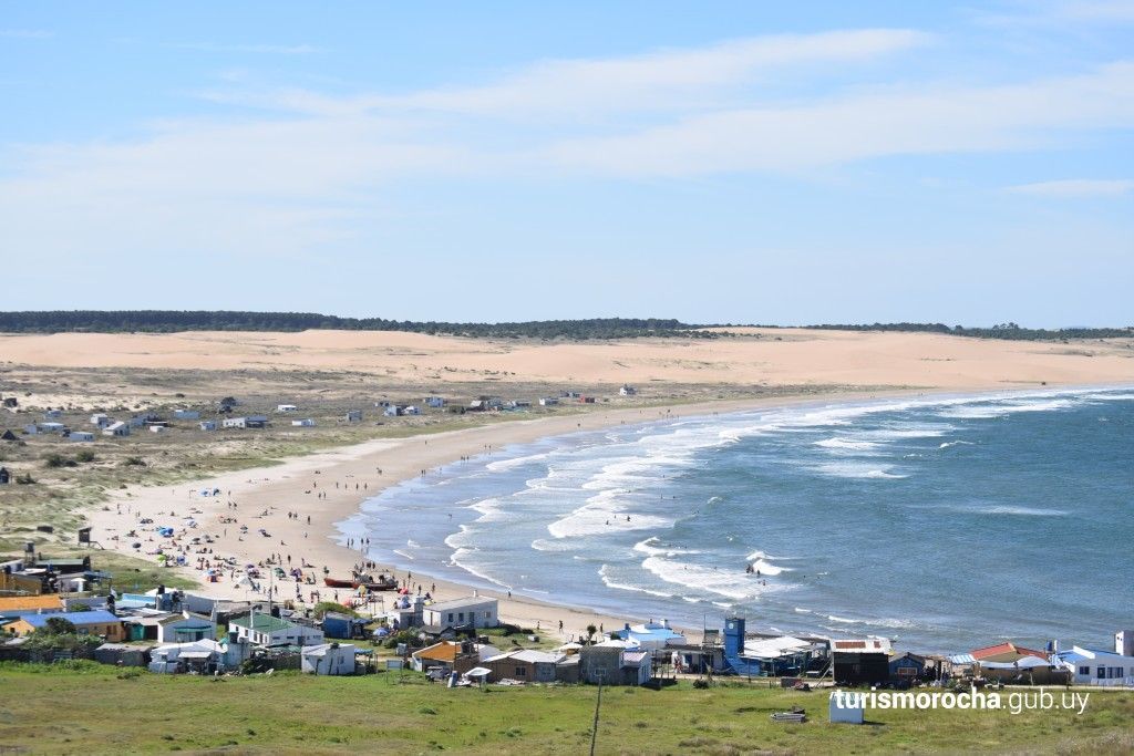 A beach with a lot of people on it