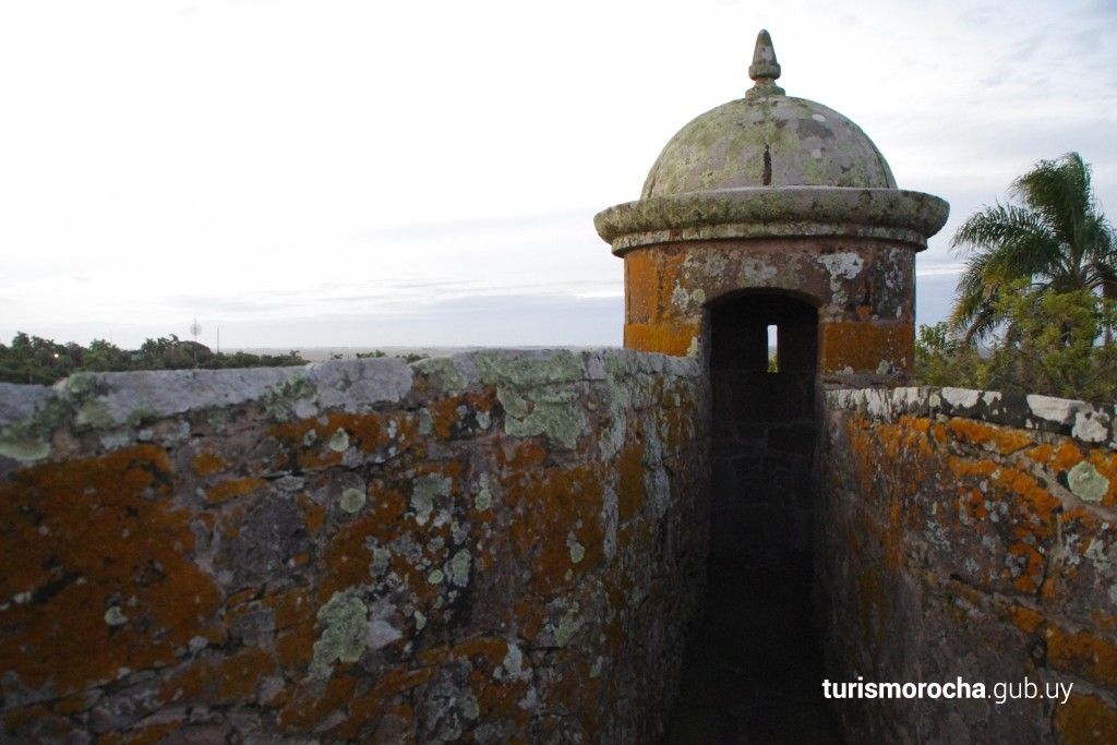 A small building with a dome on top of it