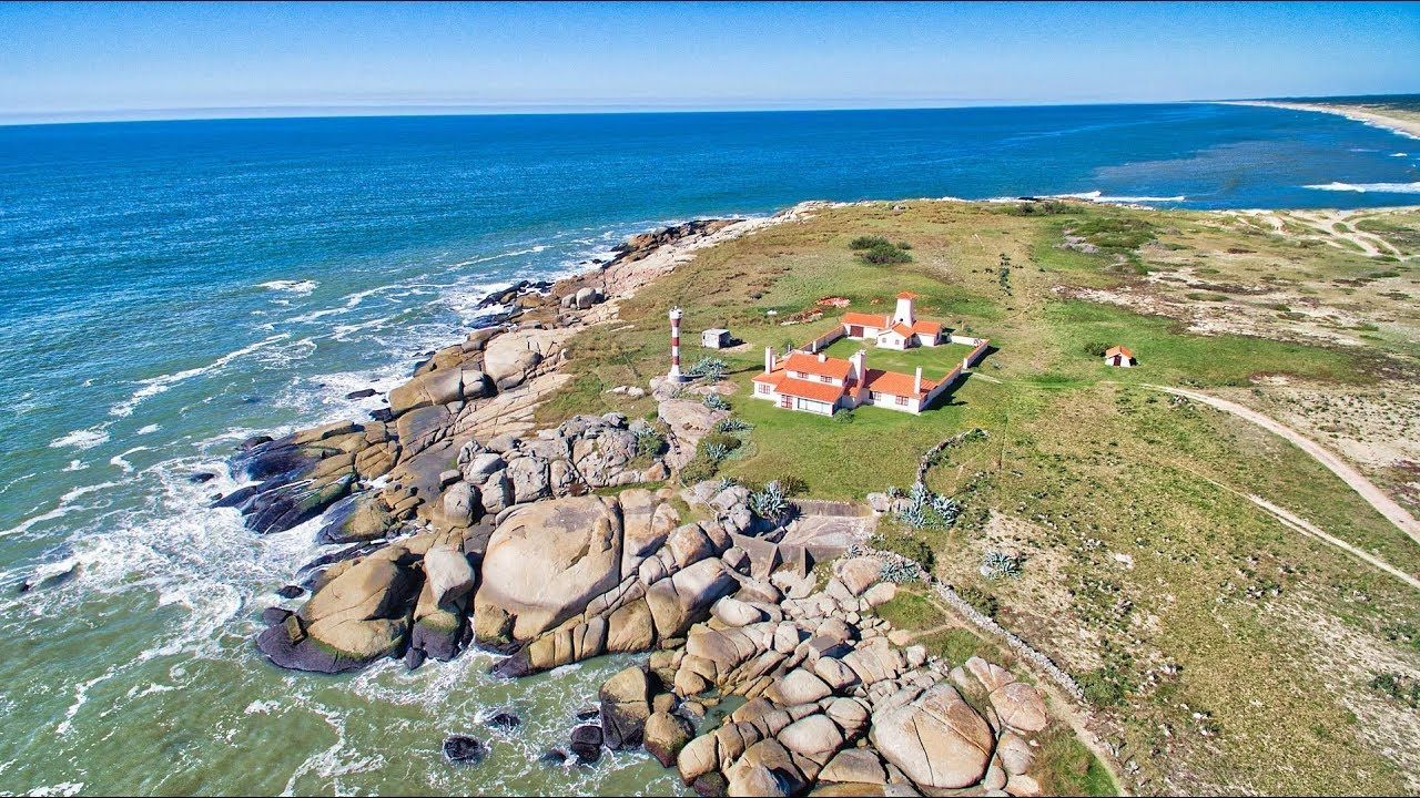 An aerial view of a small island in the middle of the ocean.