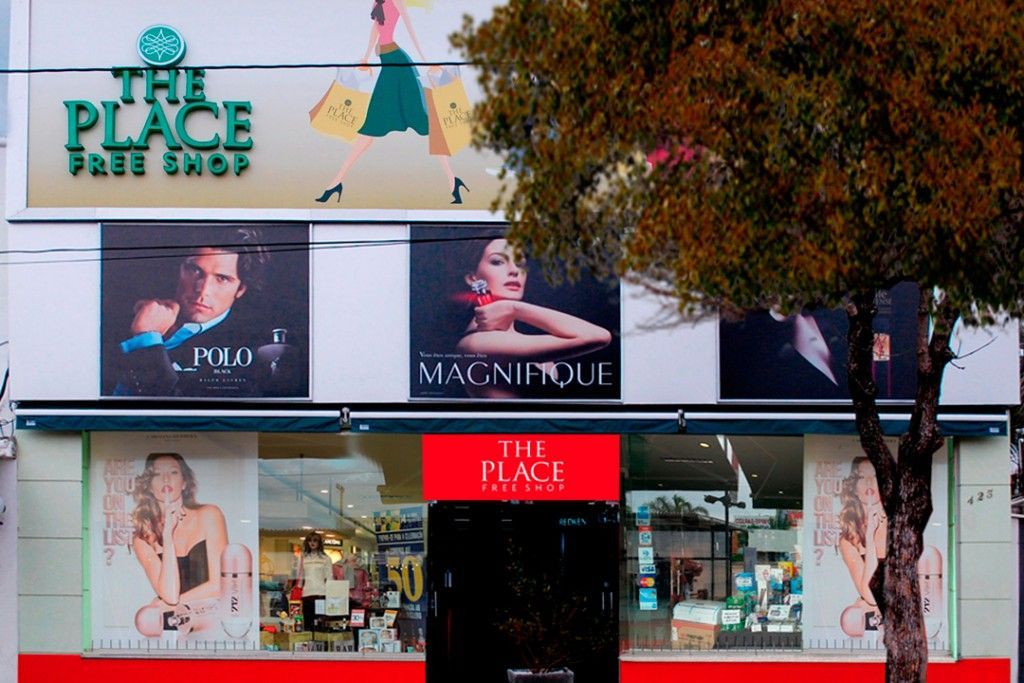 A store called the place with a tree in front of it