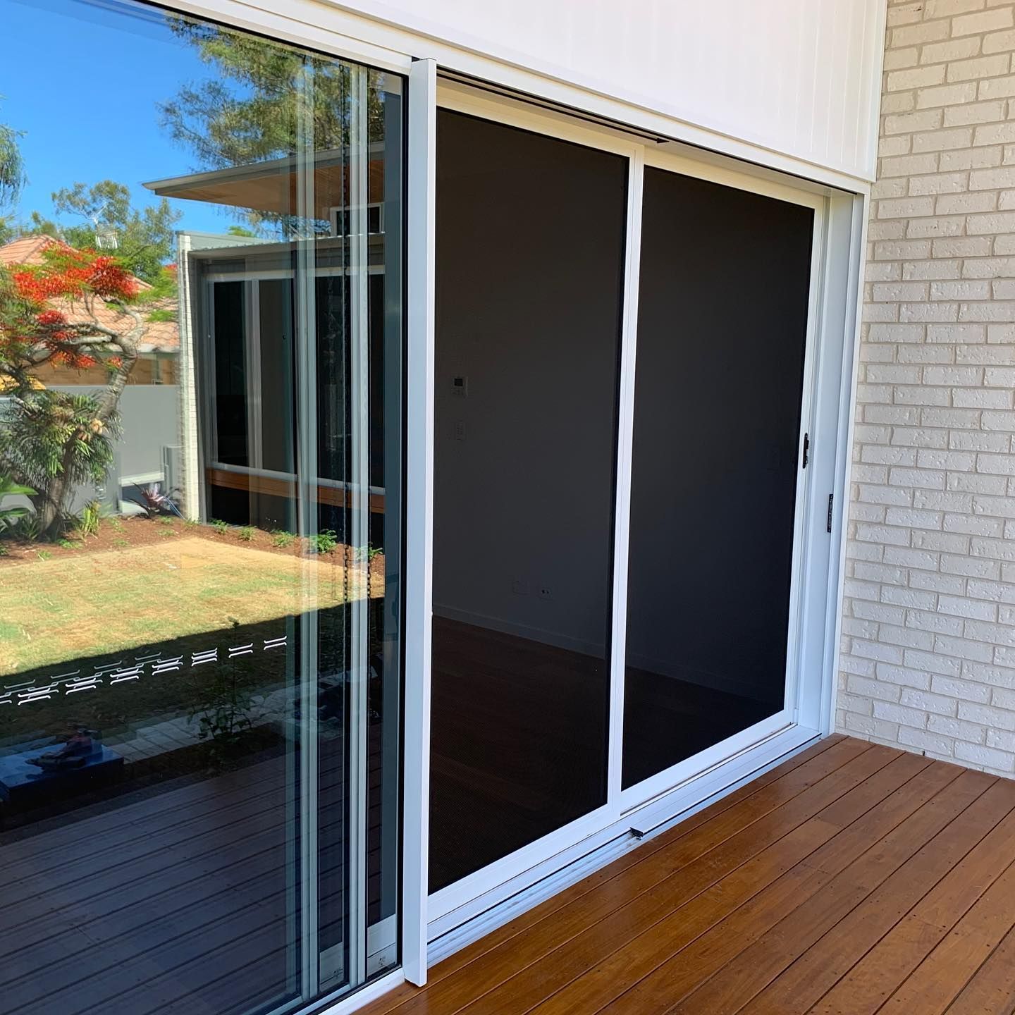 Light-colored Door Set in a Light Brick Wall — Suburban Security Screens in Currumbin, QLD