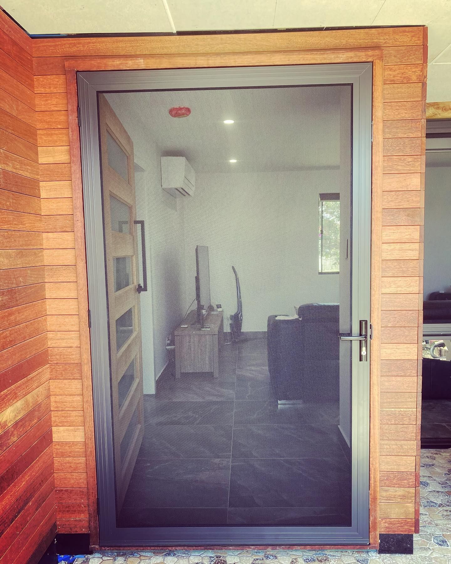 Grey Security Screen Door With a Metal Mesh Panel — Suburban Security Screens in Currumbin, QLD
