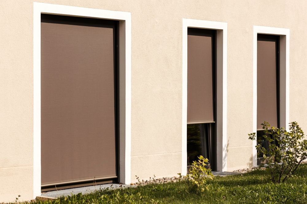 Three Brown Exterior Window Shades Installed — Suburban Security Screens in Currumbin, QLD