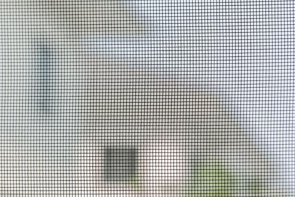 Close-up View of a Dark Window Screen Mesh — Suburban Security Screens in Currumbin, QLD