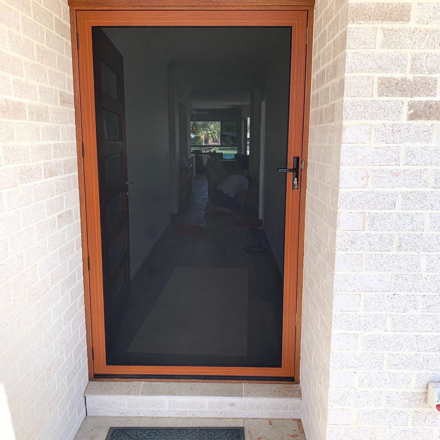 Brown-framed Screen Door Installed — Suburban Security Screens in Currumbin, QLD