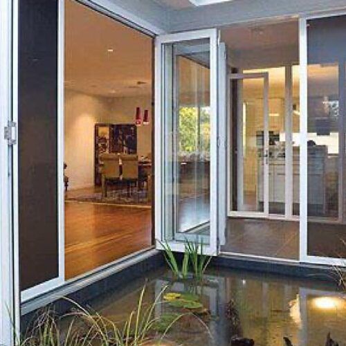 View From a Patio Featuring a Small Pond — Suburban Security Screens in Currumbin, QLD