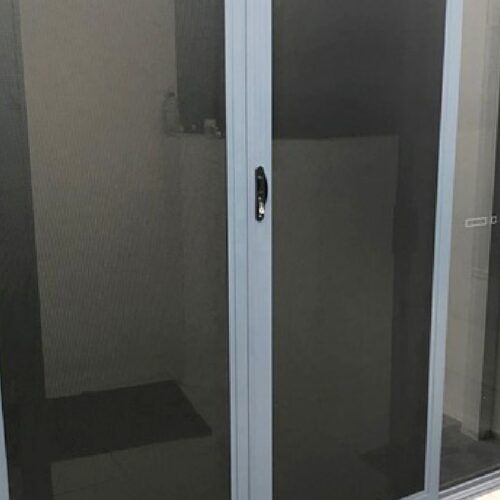 White-framed Sliding Door With Dark Grey Insect Mesh Screen — Suburban Security Screens in Currumbin, QLD