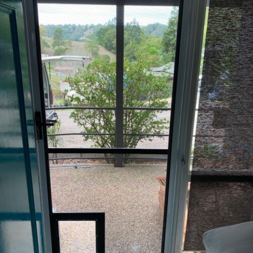 View Through a White Screen Door Looking Out — Suburban Security Screens in Currumbin, QLD