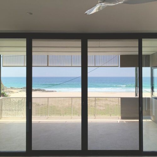 View Through Large Glass Sliding Doors Looking — Suburban Security Screens in Currumbin, QLD