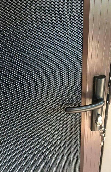 A Close-Up of A Brown-Framed Door — Suburban Security Screens in Currumbin, QLD