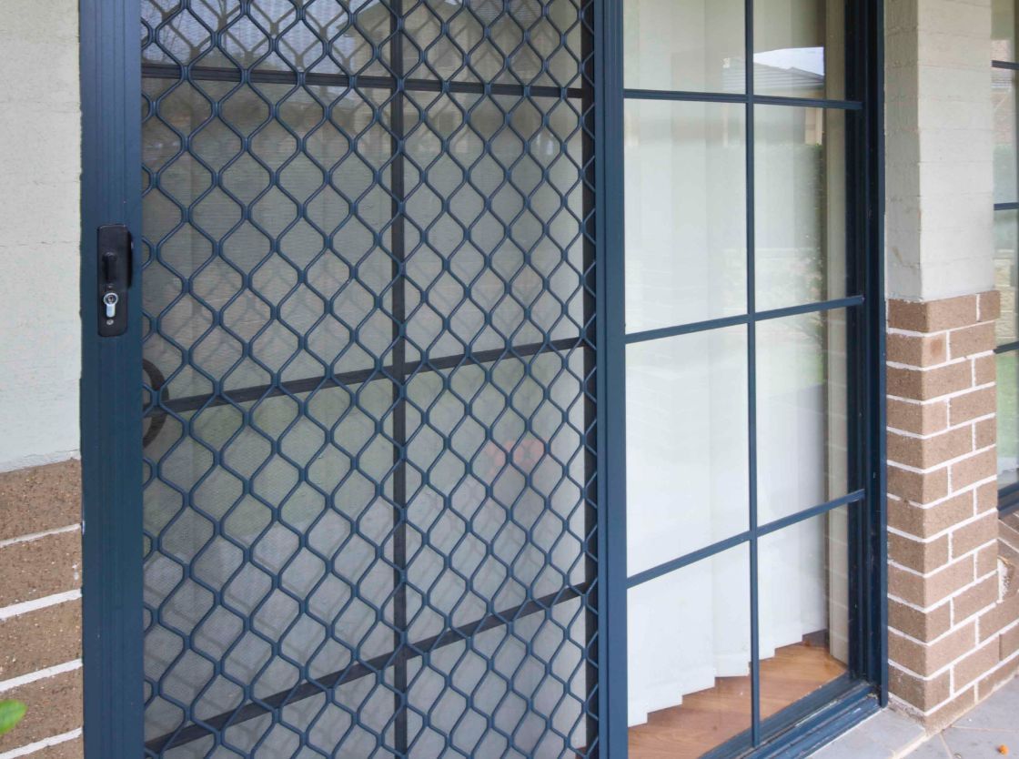 Dark-framed Sliding Security Door — Suburban Security Screens in Currumbin, QLD