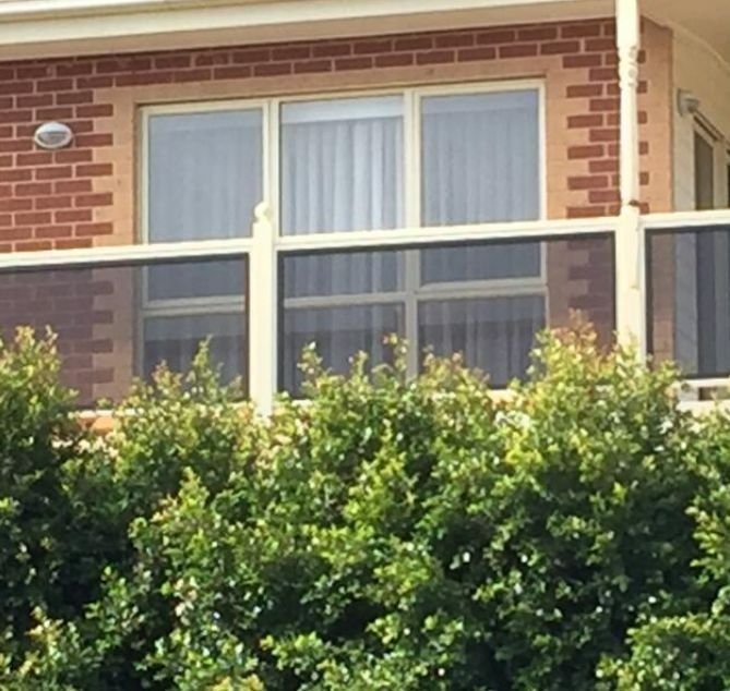 Brick-walled Building With a Balcony — Suburban Security Screens in Currumbin, QLD