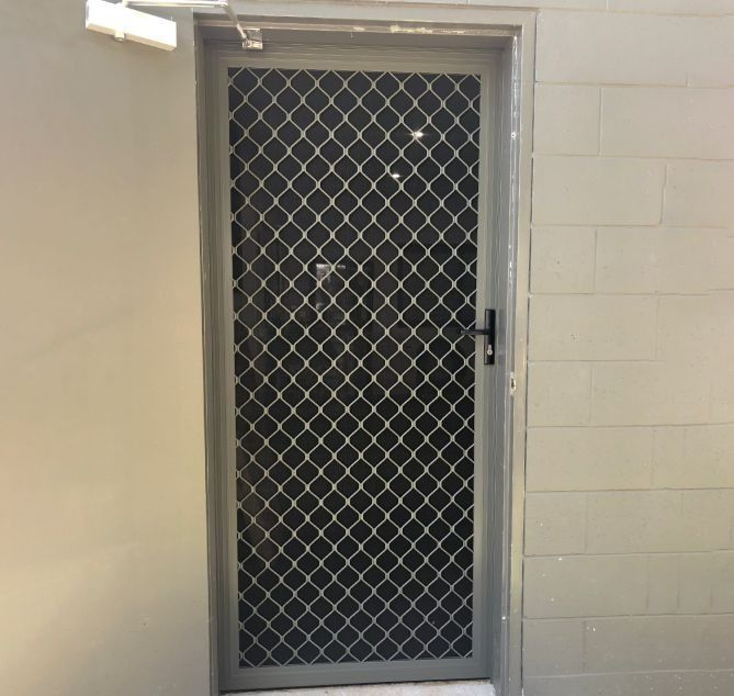 Grey Security Screen Door With a Diamond-patterned Metal — Suburban Security Screens in Currumbin, QLD