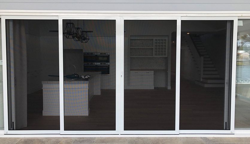 A Set of Four White-Framed Sliding Screen Doors — Suburban Security Screens in Currumbin, QLD