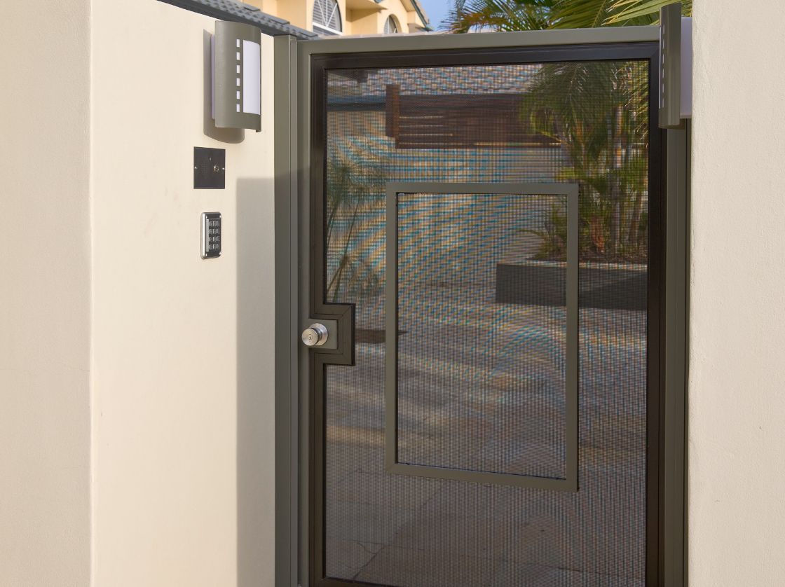 Brown Metal Pedestrian Gate With a Mesh Screen — Suburban Security Screens in Currumbin, QLD