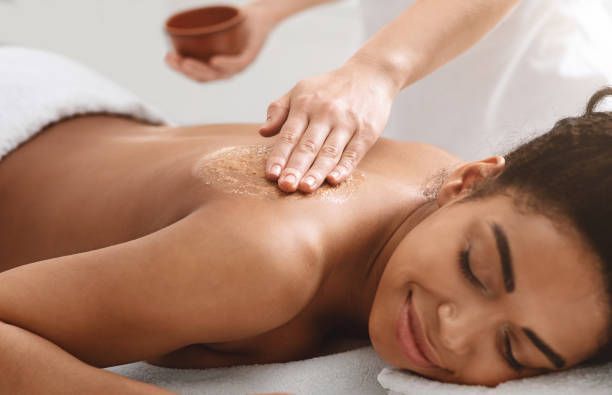 A woman is getting a massage at a spa.