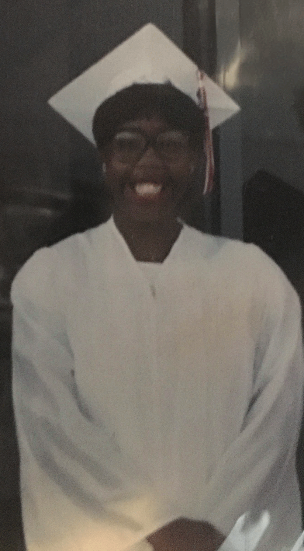 Female with glasses and a graduation cap