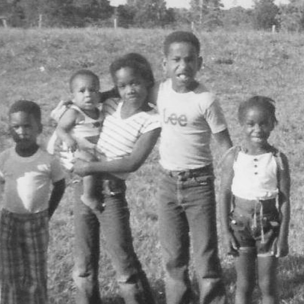 Family in the country - five children aging from a baby up to 9 or 10 years old
