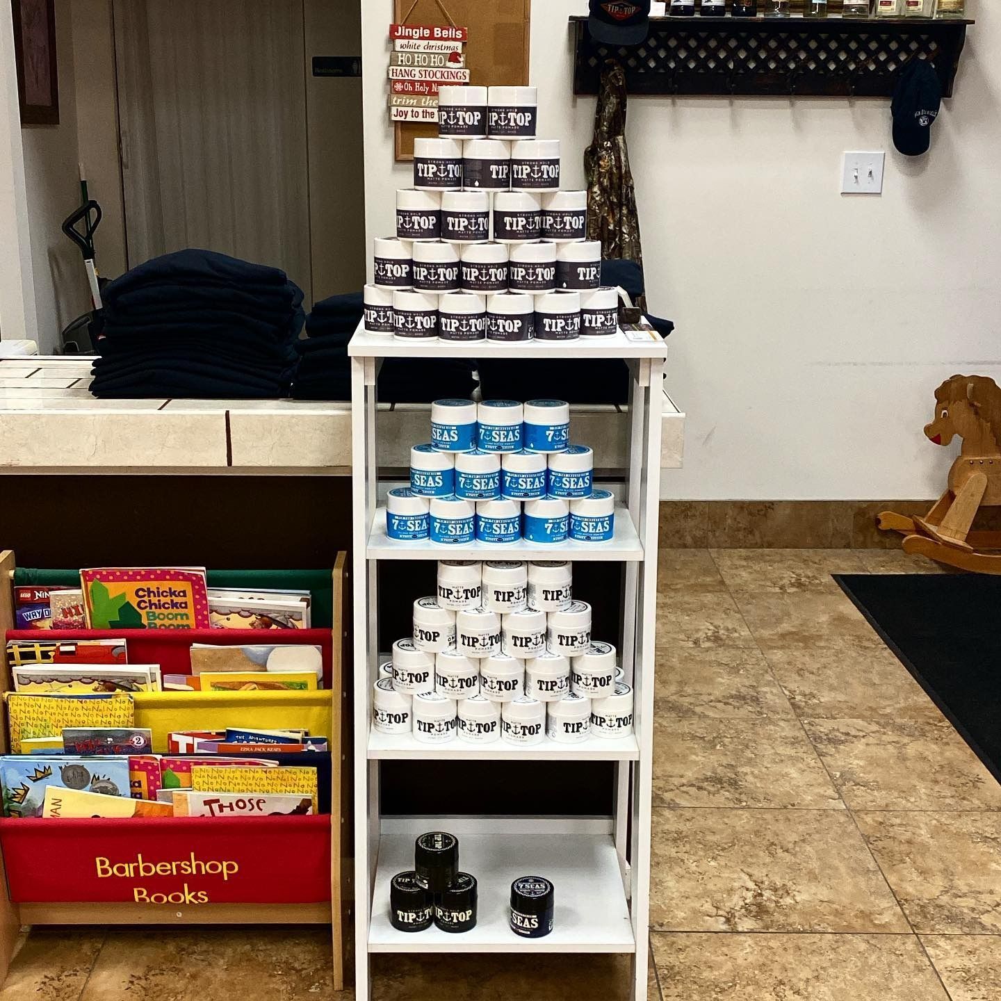 A barbershop with a display of hair products