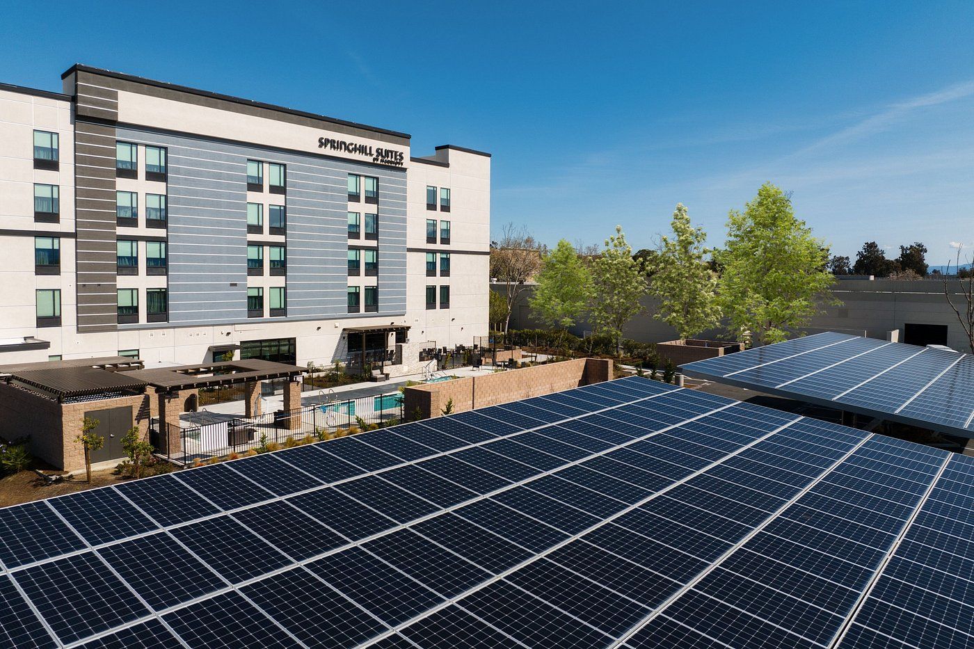 A large building with a lot of solar panels on the roof.