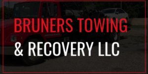 Red towing truck with text 