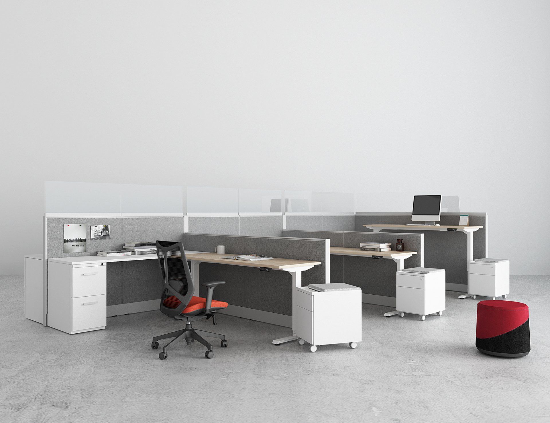 A row of cubicles with desks and chairs in an office.