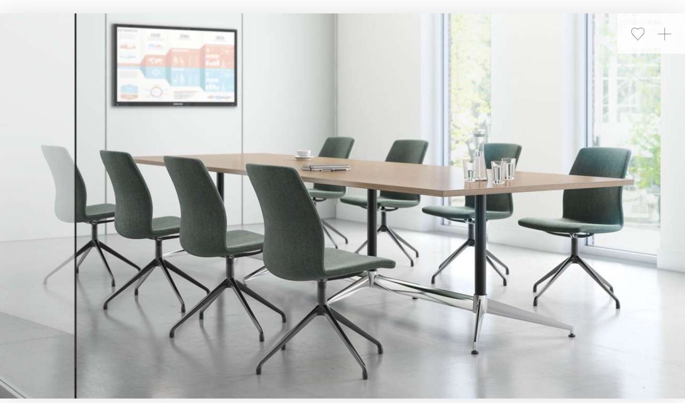 A conference room with a long table and chairs