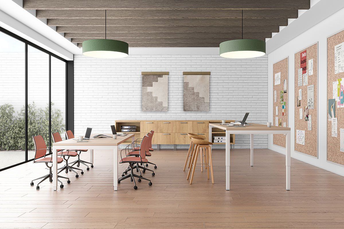 A large room with a table and chairs in it.