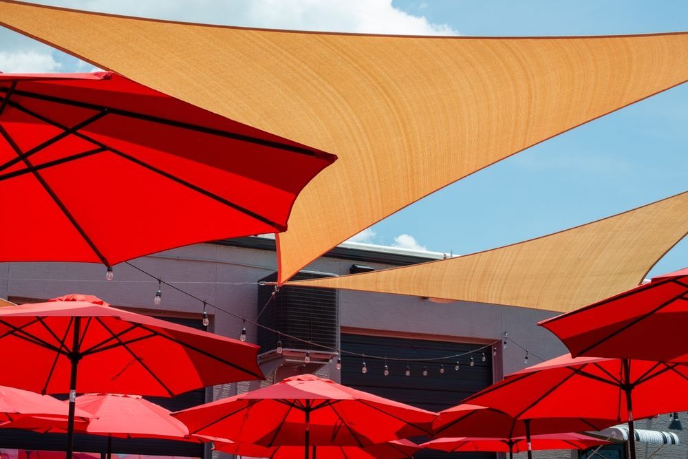Red Sails Over Patio Deck — Residential & Commercial Shade Sails in Woy Woy, NSW