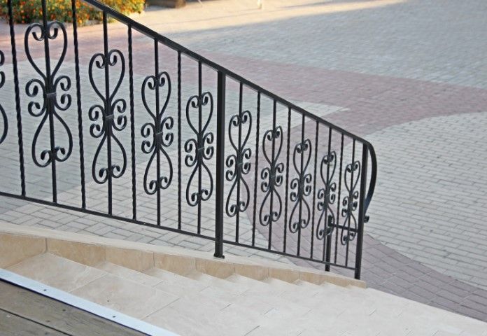 Stylish iron railing with designs along a stairway
