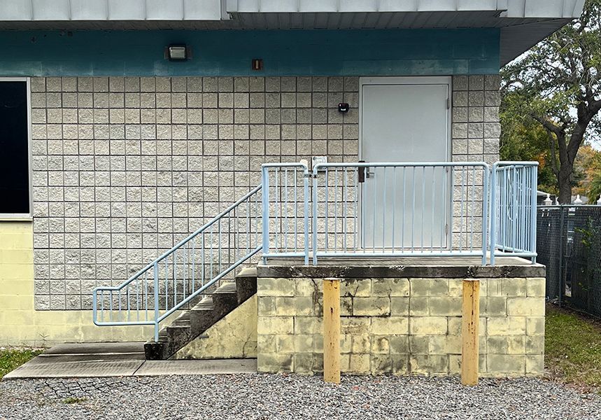 pipe railing adorning the exterior of an industrial shed in Franklin