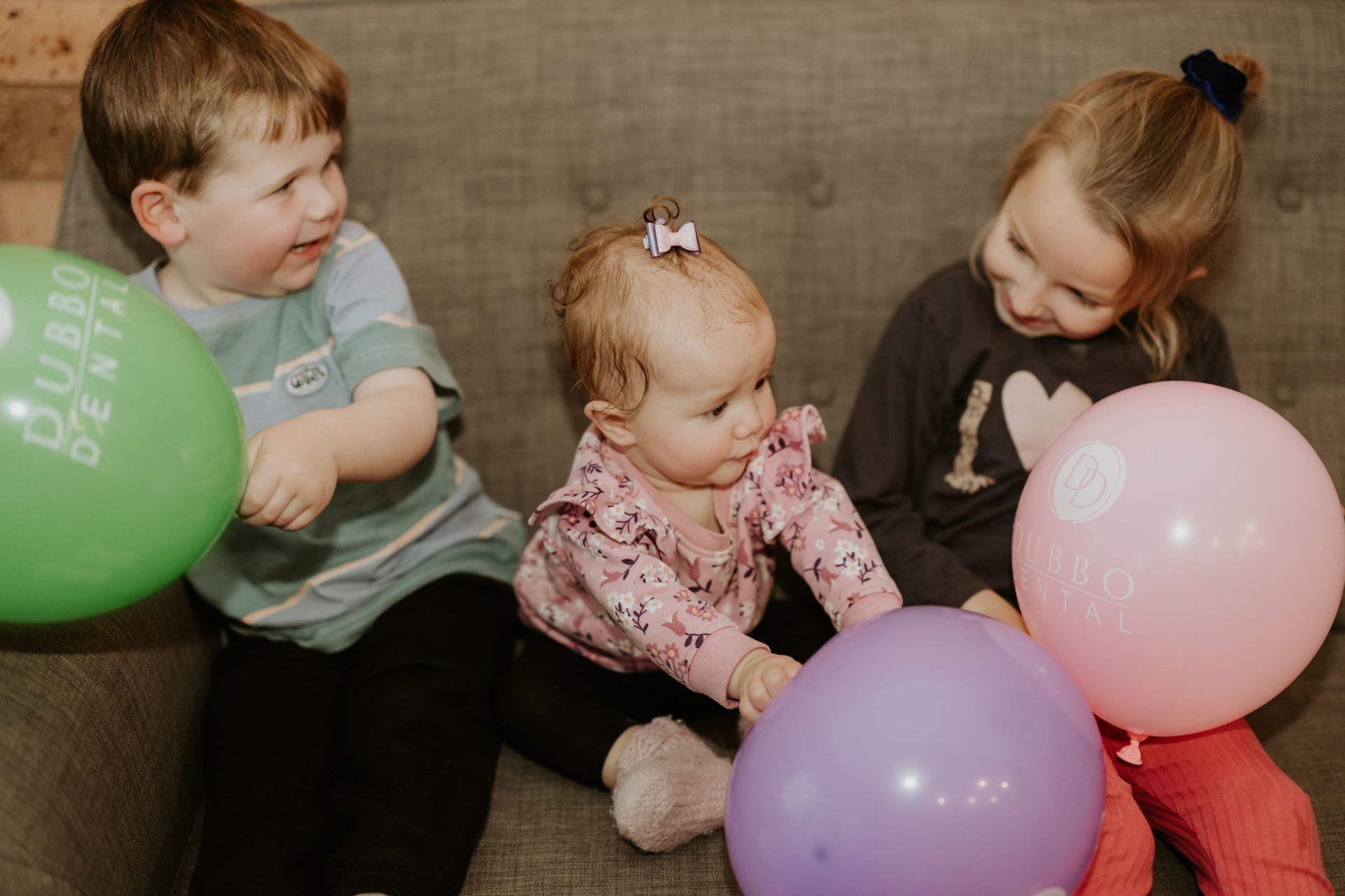 Young children playing with balloons— Dubbo Dental in Dubbo, NSW