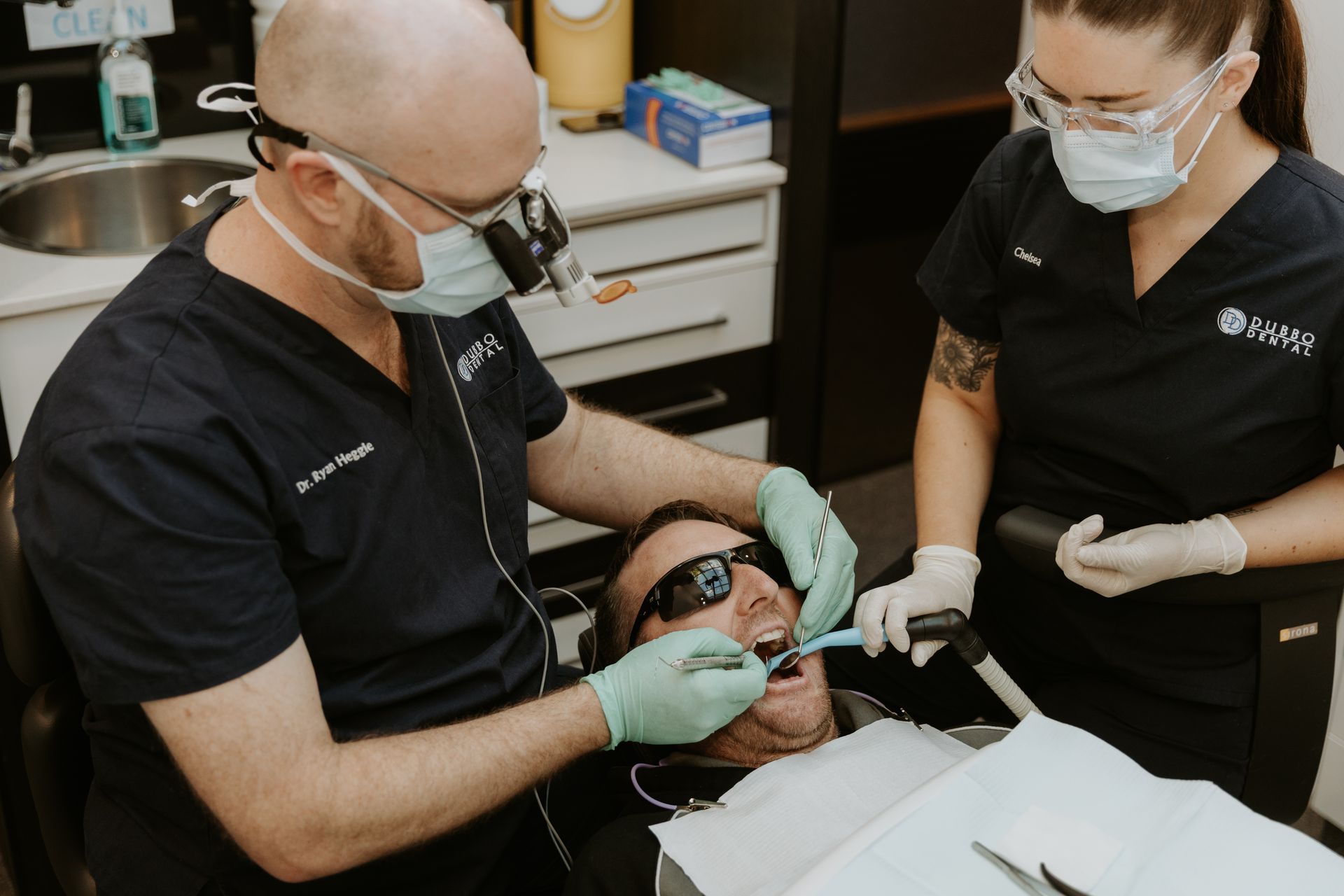 Dentist and Assistant Perform Dental Work on a Patient in an Office — Dubbo Dental in Dubbo, NSW