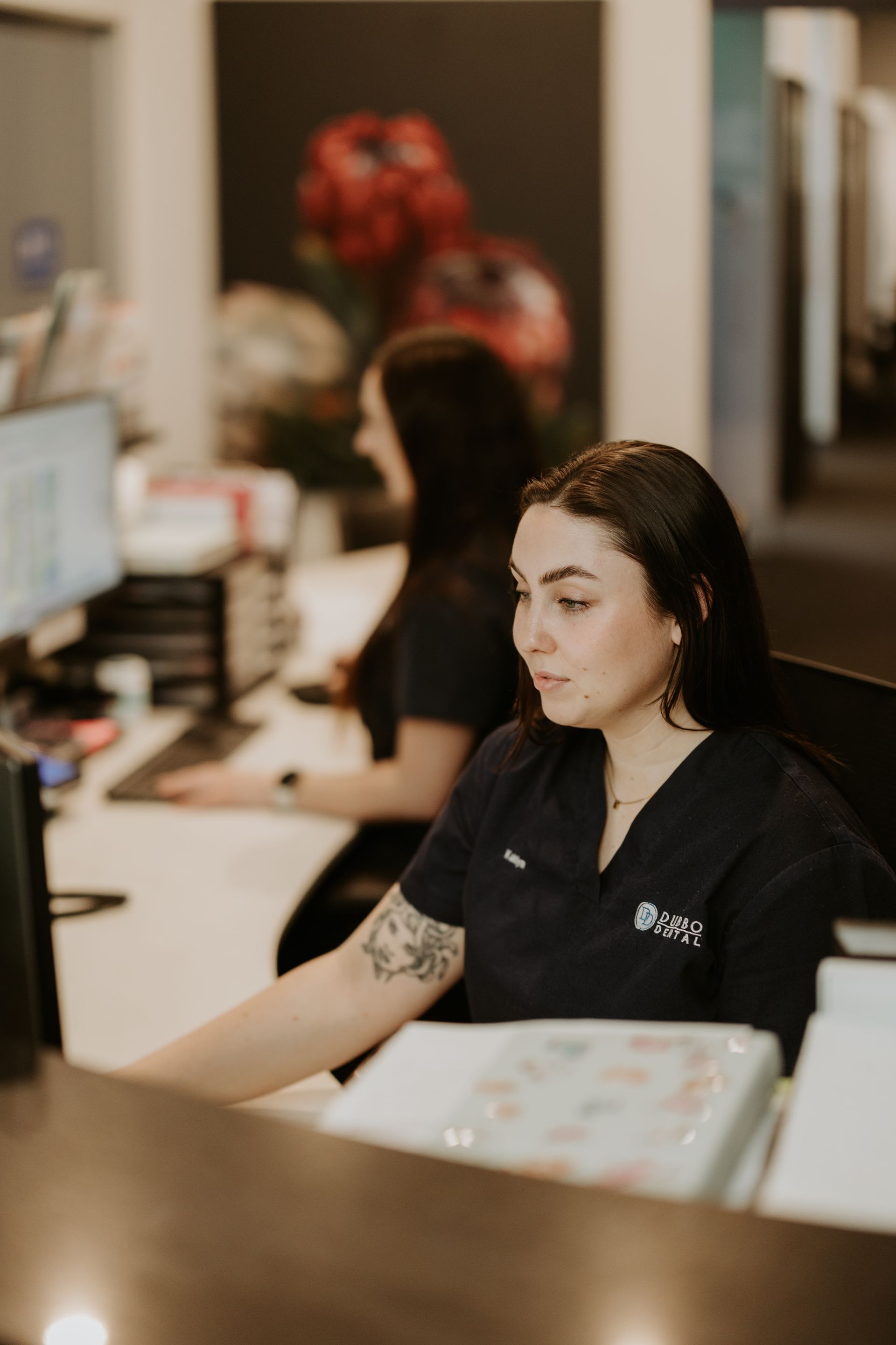 Two Women at an Office Desk — Dubbo Dental in Dubbo, NSW