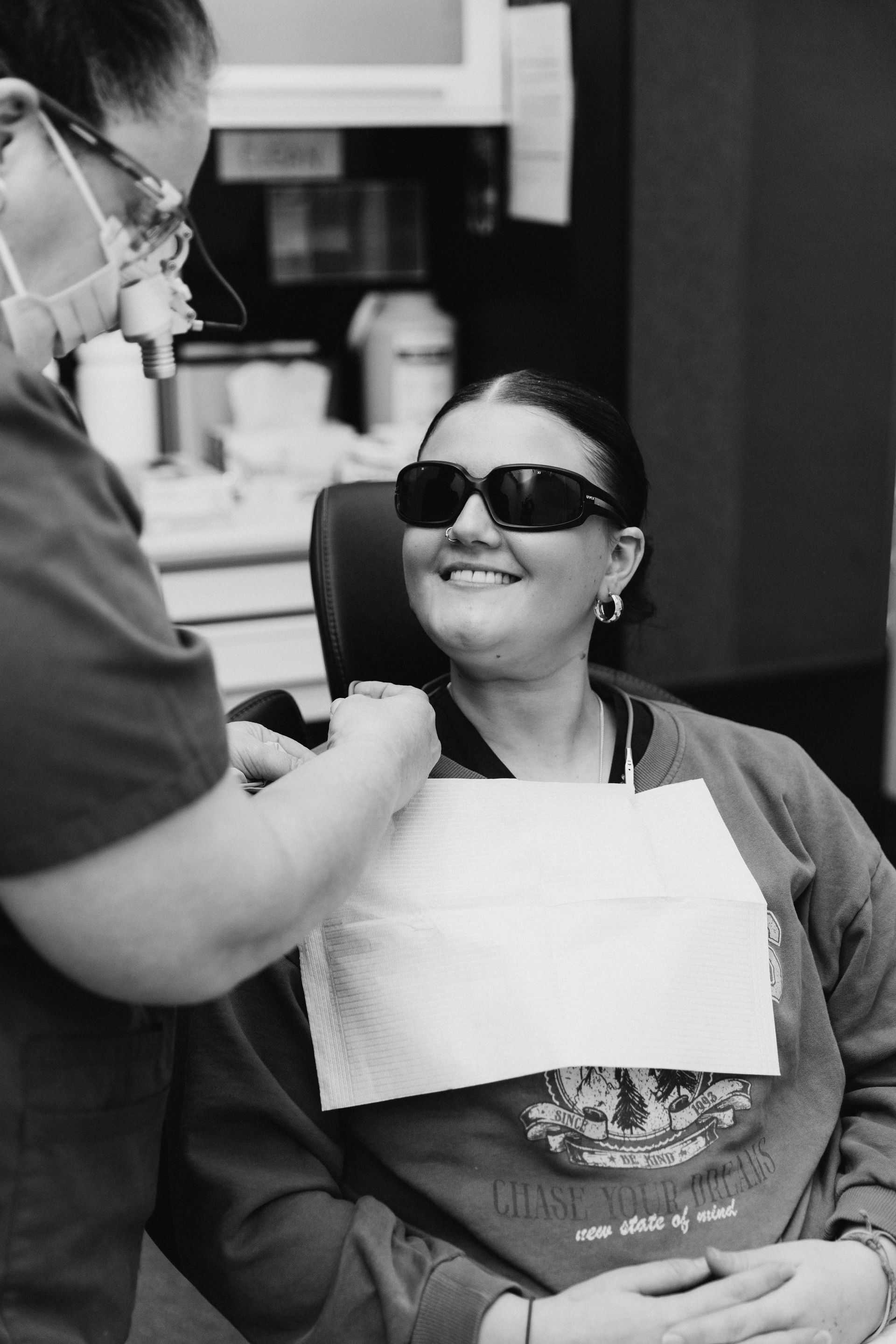 Dentist Preparing a Female Patient for a Procedure — Dubbo Dental in Dubbo, NSW