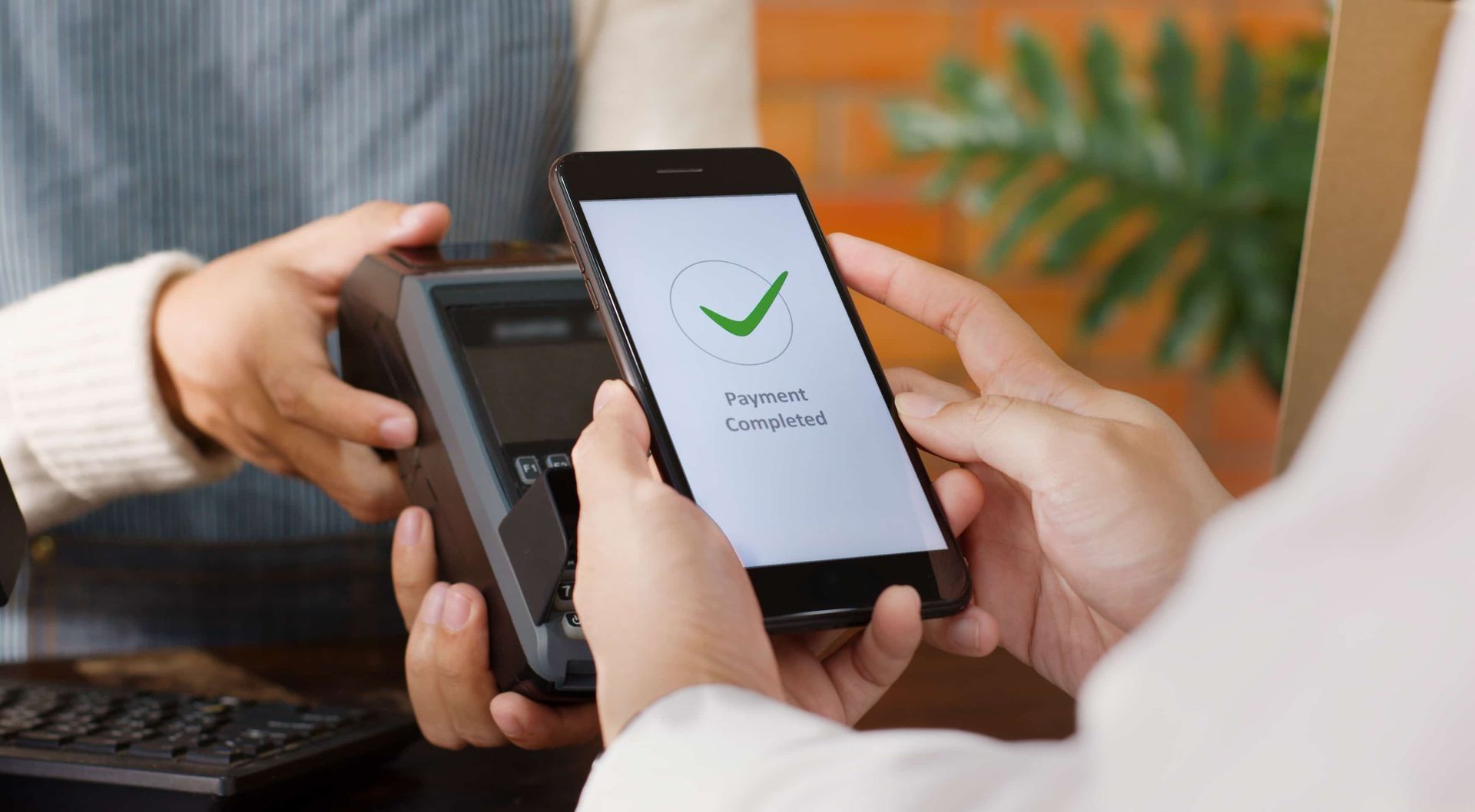 A Person is Using a Smart Phone to Pay — Dubbo Dental in Dubbo, NSW