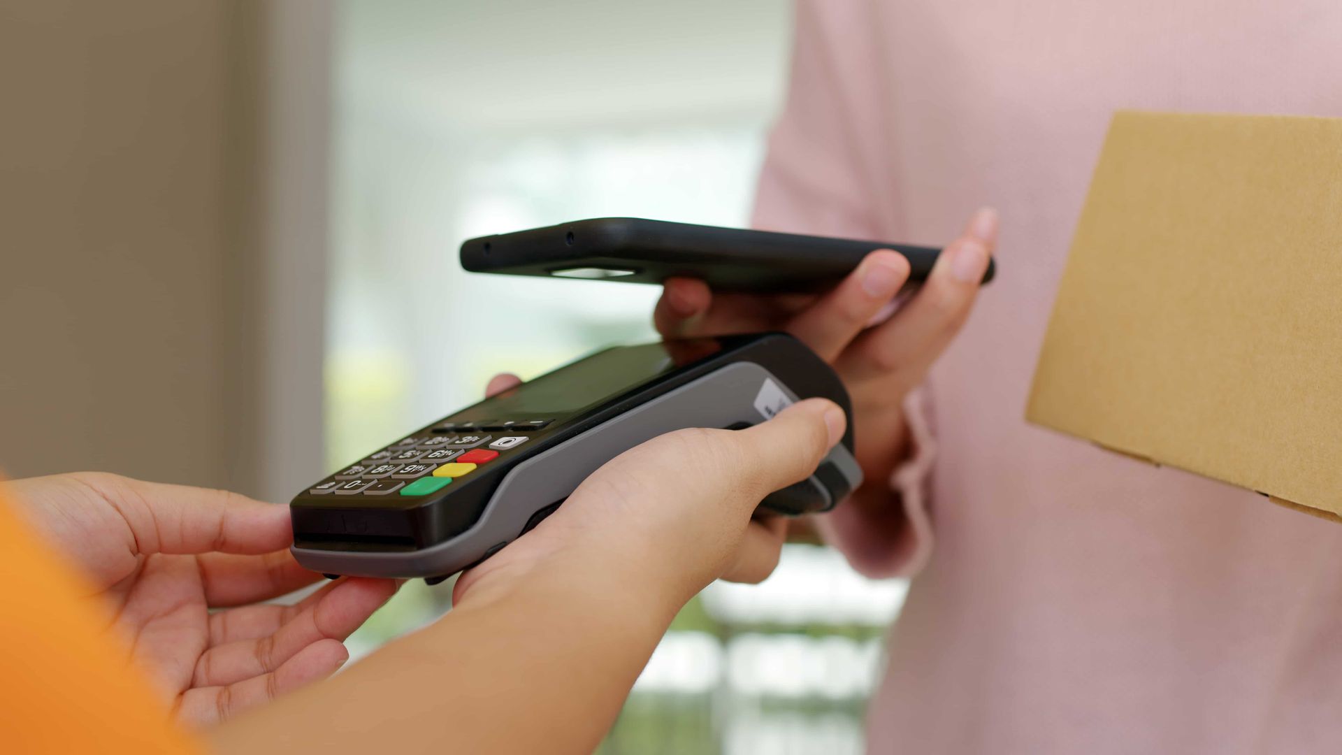A Person is Using a Cell Phone to Pay — Dubbo Dental in Dubbo, NSW